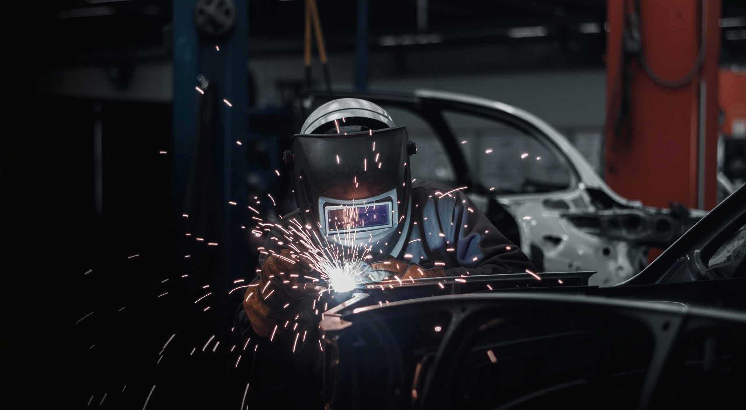 technician with welding mask on and sparks flying repairing vehicle – carrillo and sons collision center technician with welding mask on and sparks flying repairing vehicle - carrillo and sons collision center