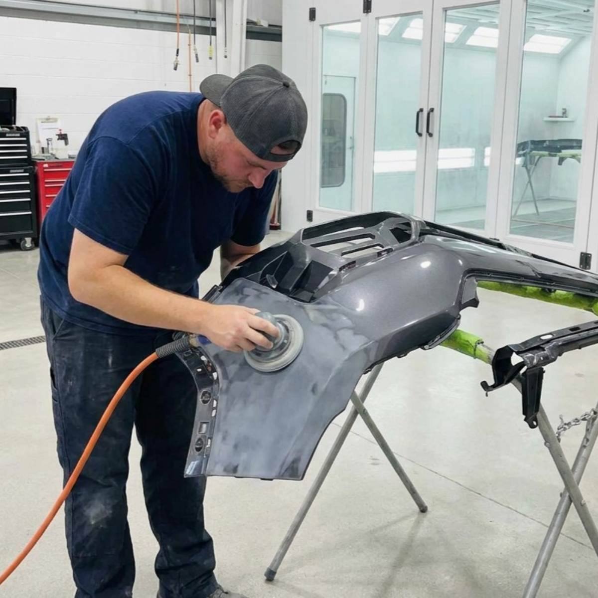 Santee Certified Collision Center tech sanding car bumper Santee Certified Collision Center tech sanding car bumper